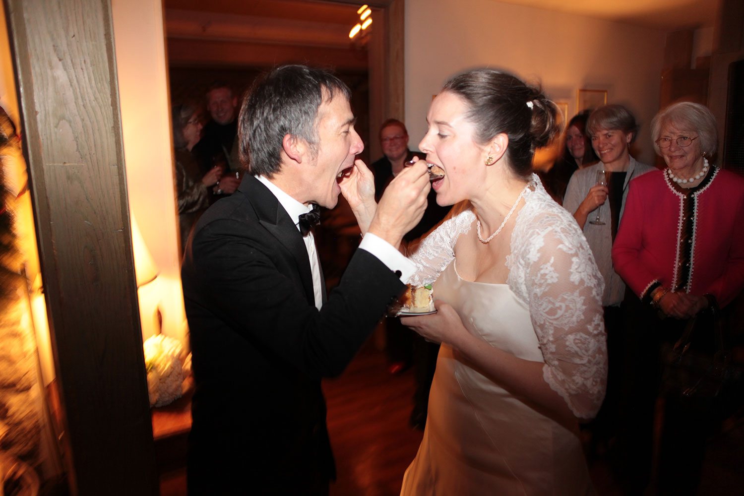 Bride and groom laughing during wedding reception